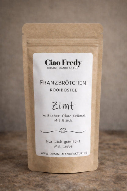 Franzbrötchen Rooibostee / Zimt im Becher. Ohne Krümel. Mit Glück.